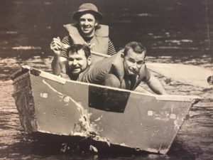 The next we tried to salvage a boat we found pinned against rocks. The Brother Dave, L, me. I don't remember the guy with the paddle.