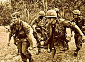 Medics rush Lt. Col. George Eyster on a stretcher toward a helicopter after he had been shot by a Viet Cong sniper at Trung Lap, South Vietnam, Jan. 16, 1966. Eyster, 43, of Florida and commander of the "Black Lions" battalion of the U.S. 1st Division, died 42 hours later in a Bien Hoa hospital. (AP Photo/Horst Faas)