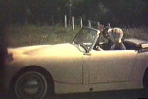 Donna, driving, and her sister, Karen, in Donna's Austin Healey.